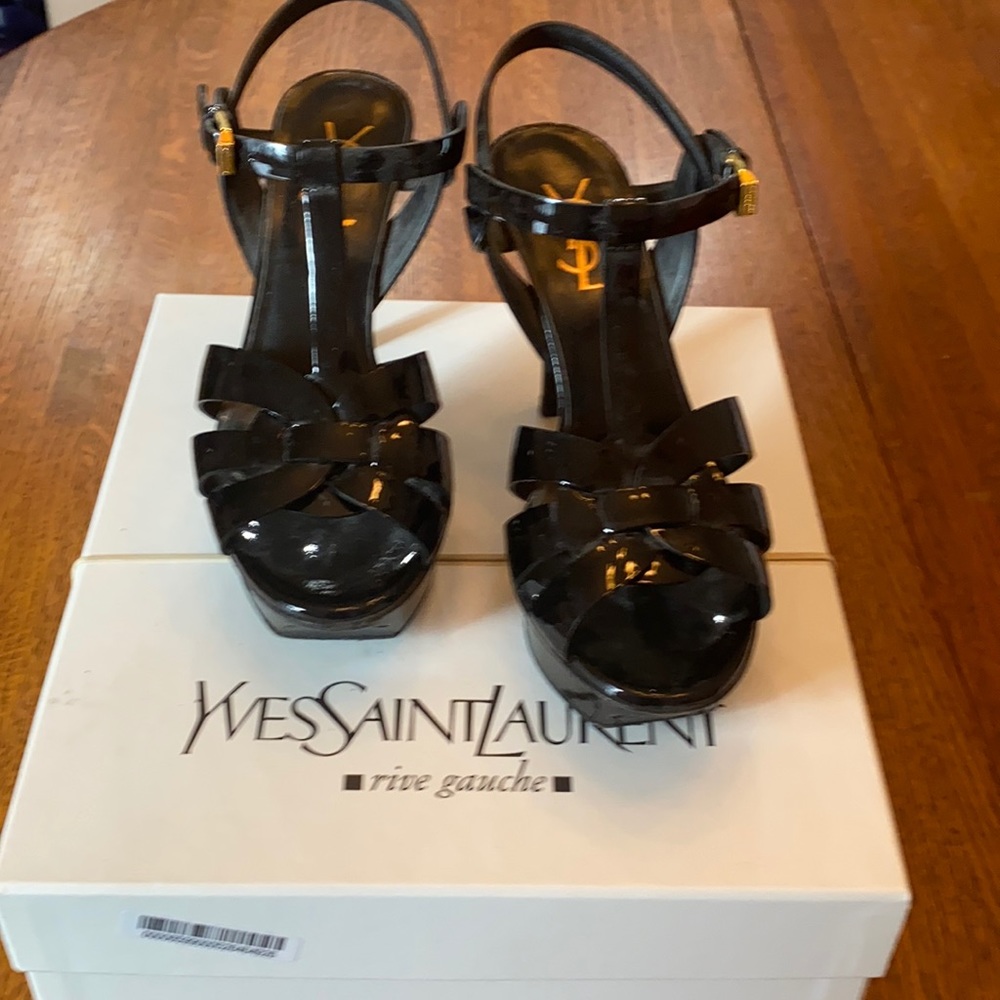 Black patent YSL Tribute sandals.
